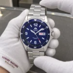 Orient FAA02002D9 held in white cotton gloves with Luxury Watches Malaysia cuff mark