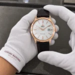 Orient FAC00002W0 held in white cotton gloves with Luxury Watches Malaysia cuff mark