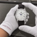 Orient FAC00009W0 held in white cotton gloves with Luxury Watches Malaysia cuff mark