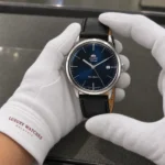 Orient FAC0000DD0 held in white cotton gloves with Luxury Watches Malaysia cuff mark