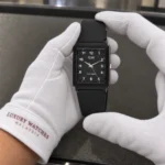 Casio MQ-27-1B held in white cotton gloves with Luxury Watches Malaysia cuff mark