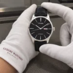 Citizen NH8350-08E held in white cotton gloves with Luxury Watches Malaysia cuff mark