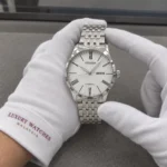 Citizen NH8350-59A held in white cotton gloves with Luxury Watches Malaysia cuff mark