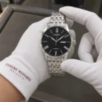 Citizen NH8350-59E held in white cotton gloves with Luxury Watches Malaysia cuff mark