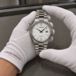 Citizen NJ0150-81A held in white cotton gloves with Luxury Watches Malaysia cuff mark