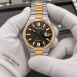 Citizen NJ0154-80H held in white cotton gloves with Luxury Watches Malaysia cuff mark