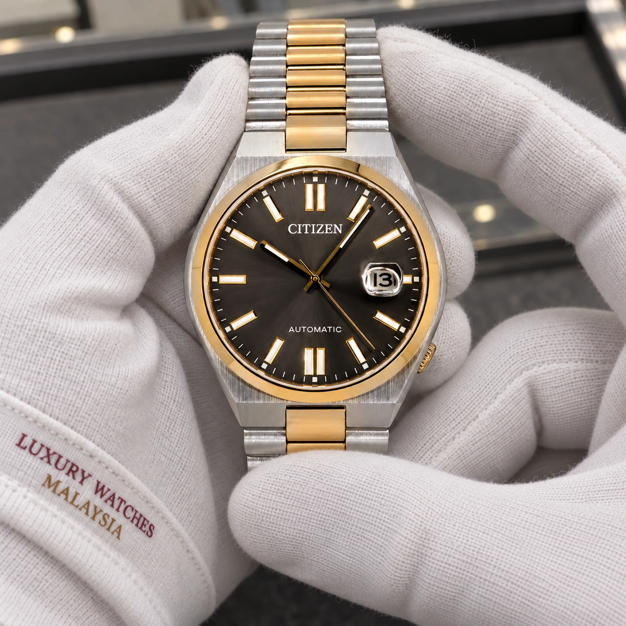 Citizen NJ0154-80H presented in cotton gloves