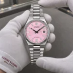 Citizen NJ0200-50Z held in white cotton gloves with Luxury Watches Malaysia cuff mark