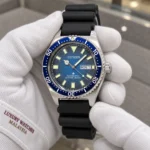 Citizen NY0129-07L held in white cotton gloves with Luxury Watches Malaysia cuff mark