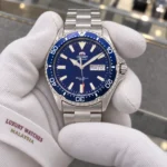 Orient RA-AA0002L19B held in white cotton gloves with Luxury Watches Malaysia cuff mark