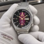 Orient RA-AA0B02R19B held in white cotton gloves with Luxury Watches Malaysia cuff mark