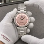 Orient RA-AC0M11Y held in white cotton gloves with Luxury Watches Malaysia cuff mark