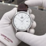 Orient RA-AP0002S10B held in white cotton gloves with Luxury Watches Malaysia cuff mark