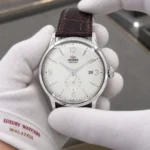 Orient RA-AP0003S10B held in white cotton gloves with Luxury Watches Malaysia cuff mark