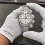 Seiko SNK355K1 held in white cotton gloves with Luxury Watches Malaysia cuff mark