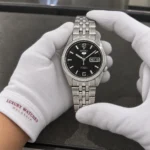 Seiko SNK393K1 held in white cotton gloves with Luxury Watches Malaysia cuff mark
