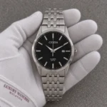 Citizen BI5000-87E watch in a white cotton glove under subdued room lighting — illustrative image