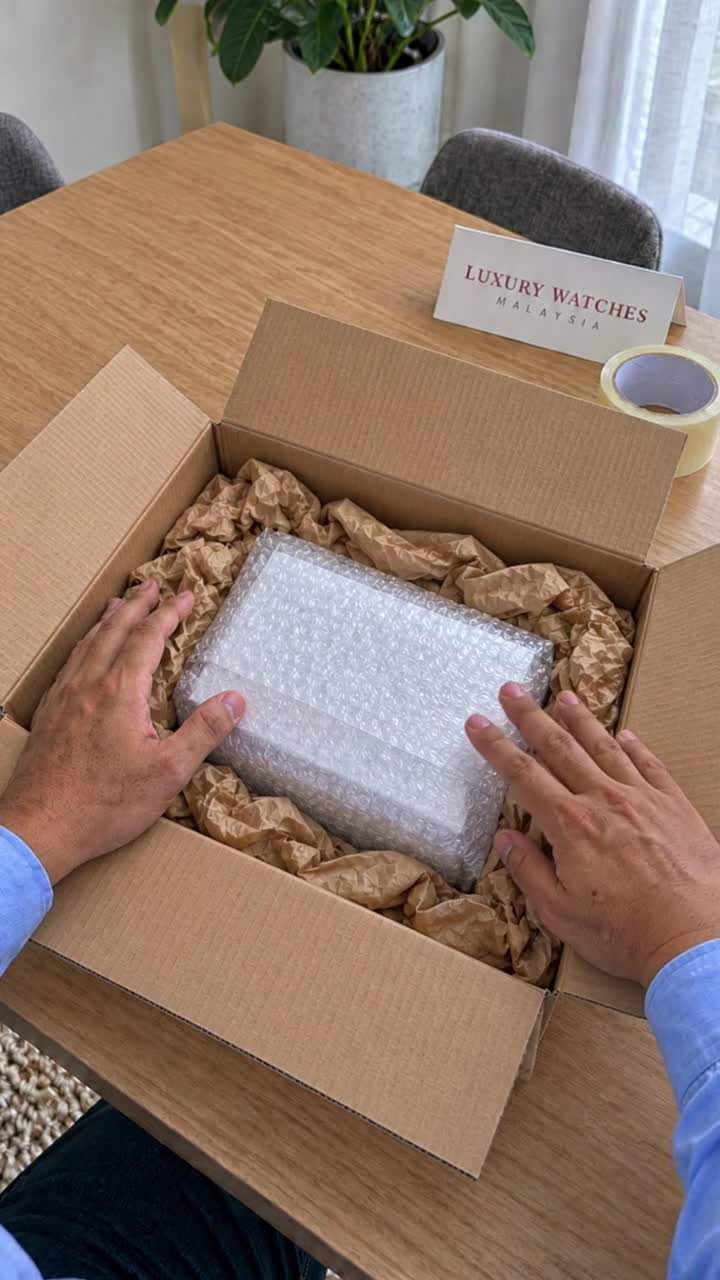 Our watch box cushioned inside its shipping carton