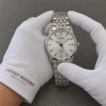 Citizen Stainless Steel Bracelet Silver Dial Quartz BI5000-87A Men's Watch presented by cotton-gloved hands with wrist-cuff branding