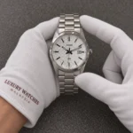 Casio Analog Stainless Steel Silver Dial Quartz MTP-VD03D-7A MTPVD03D-7 Men's Watch presented by cotton-gloved hands with wrist-cuff branding