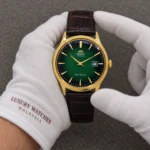 Orient Bambino Version 4 Automatic FAC08002F0 TAC08002F0 Men's Watch presented by cotton-gloved hands with wrist-cuff branding